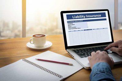 Laptop with liability insurance on screen, general liability insurance quote